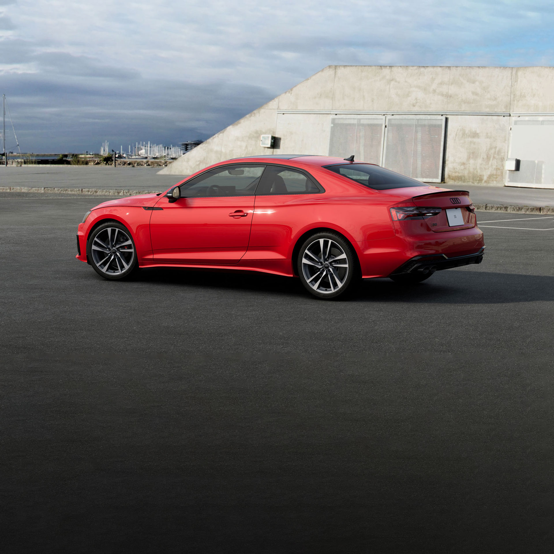 Three quarter rear view of the Audi S5 Coupé parked.