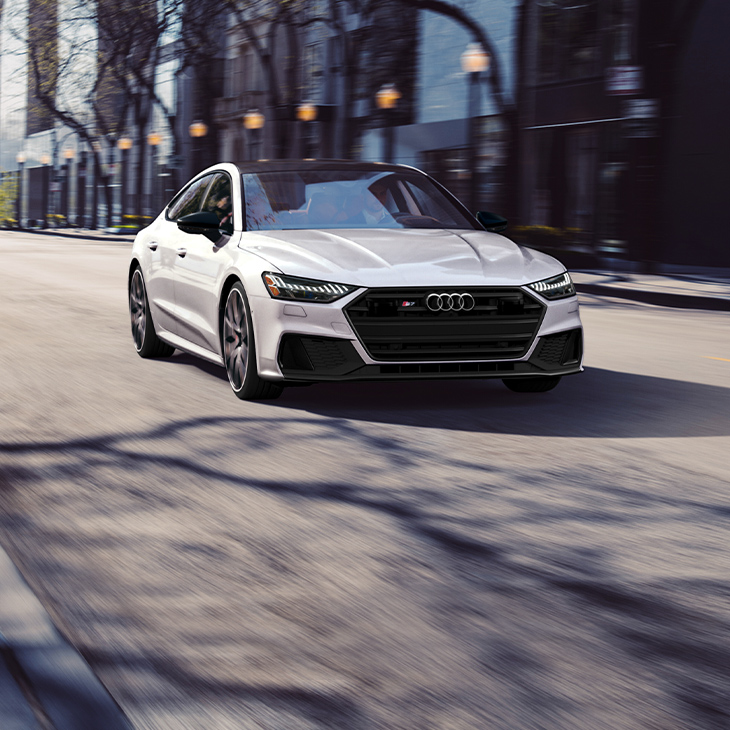 Three-quarter front view of the Audi S7 Sportback accelerating.