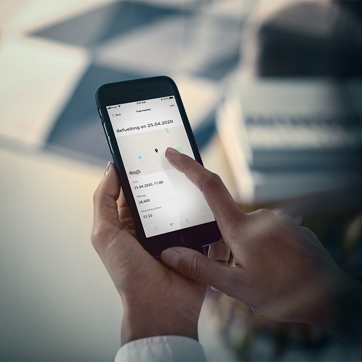Close up of a person's hands interacting with the Audi connect Plug and Play app.