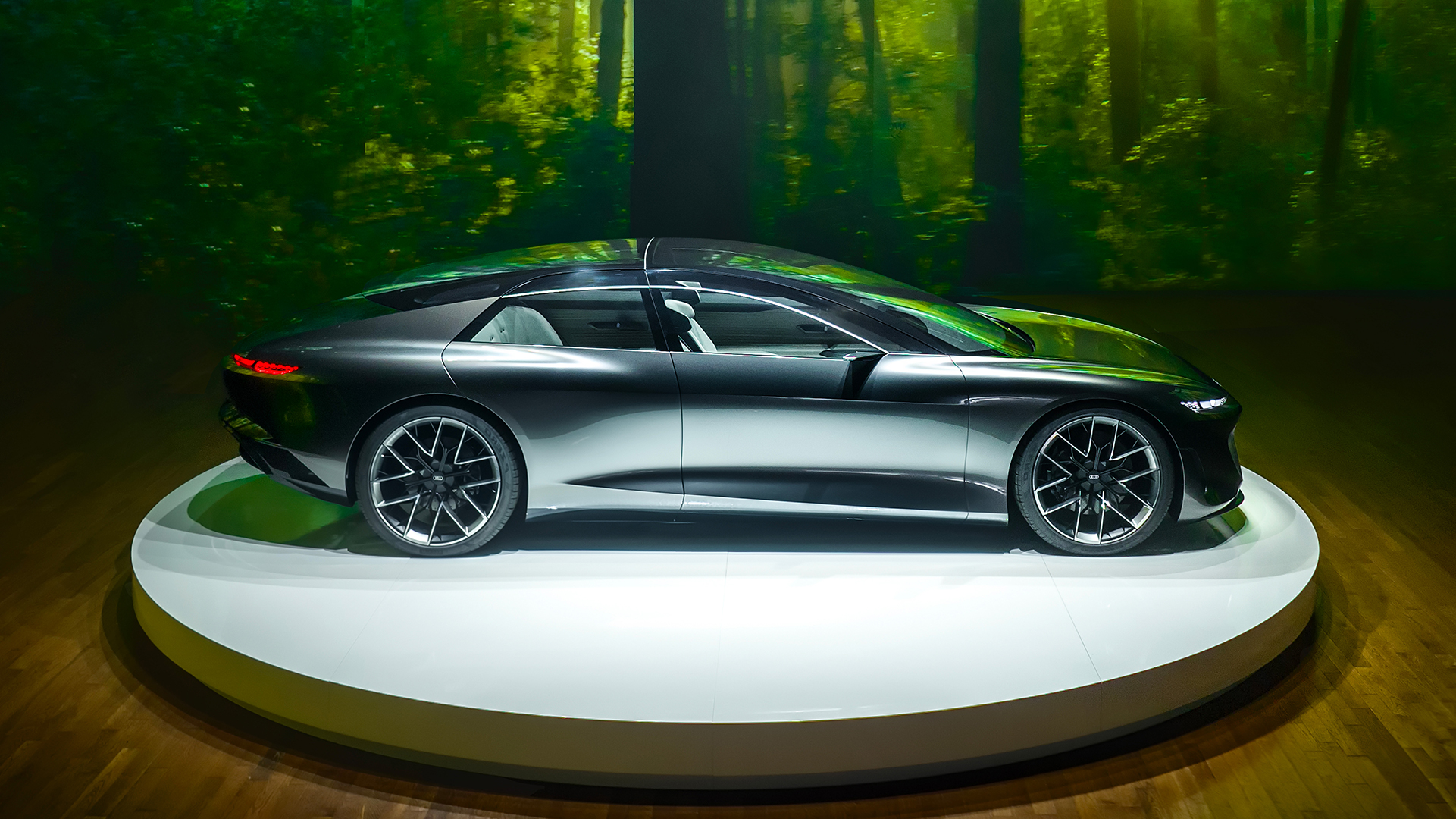 Side profile of an Audi concept vehicle parked on stage.