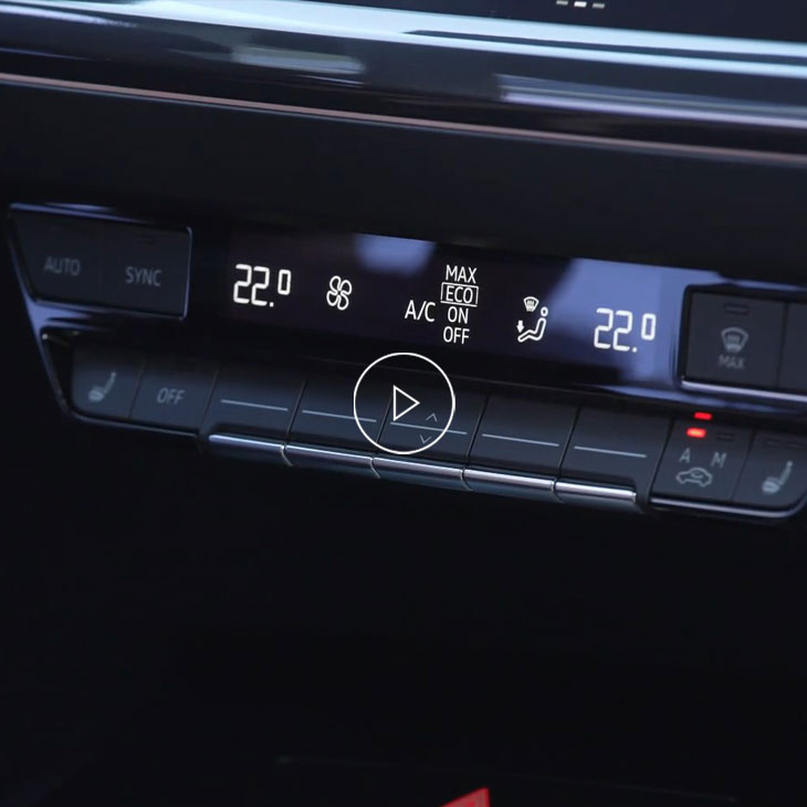 A close up on the climate control options inside an Audi vehicle. 