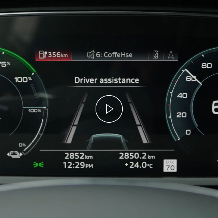 Close-up of the Audi MMI system displaying Active lane assist technology. 