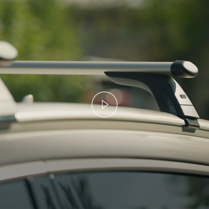 Close-up of an Audi carrier unit attached to the roof of a vehicle. 