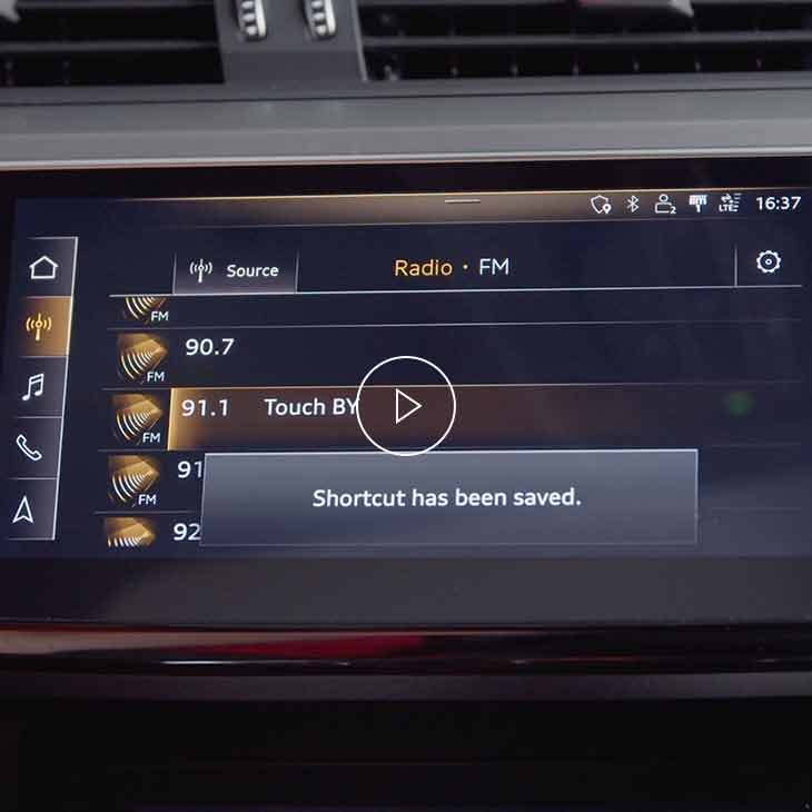 Close-up photo of the Saved shortcuts screen on the Audi MMI display inside an Audi vehicle.