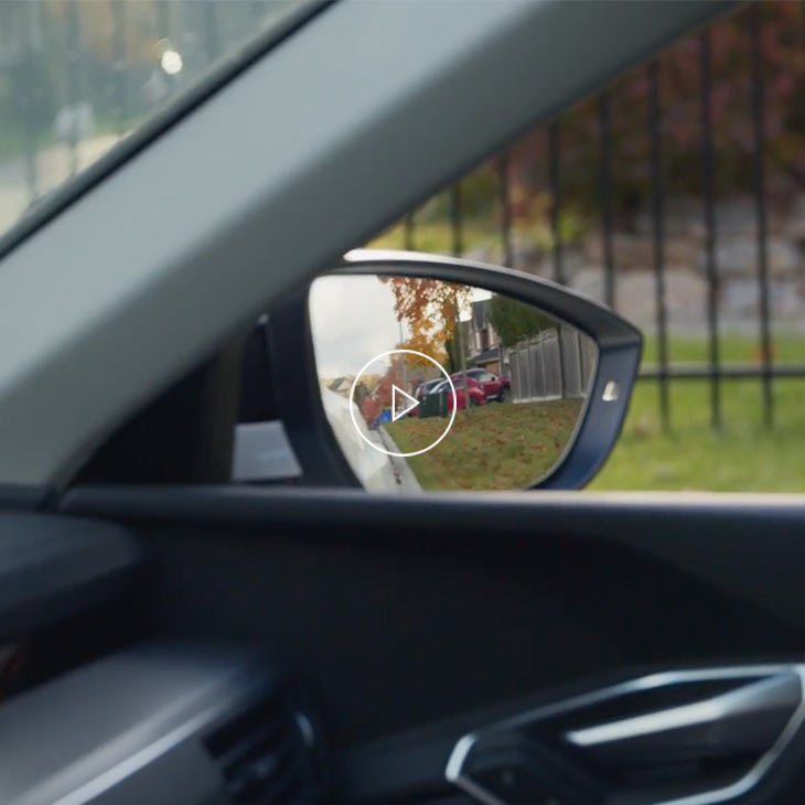  Photo of the rear view mirror of an Audi vehicle.