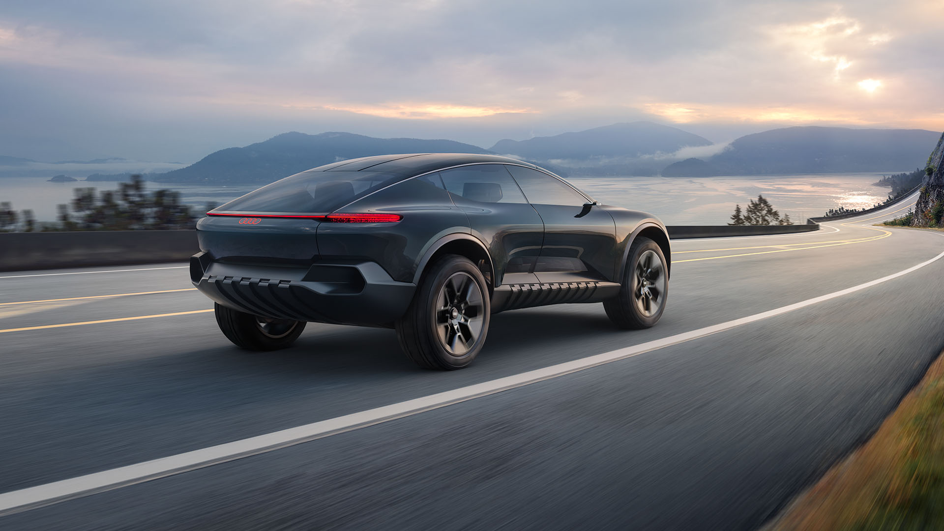 Three-quarter rear view of the Audi activesphere concept vehicle accelerating.