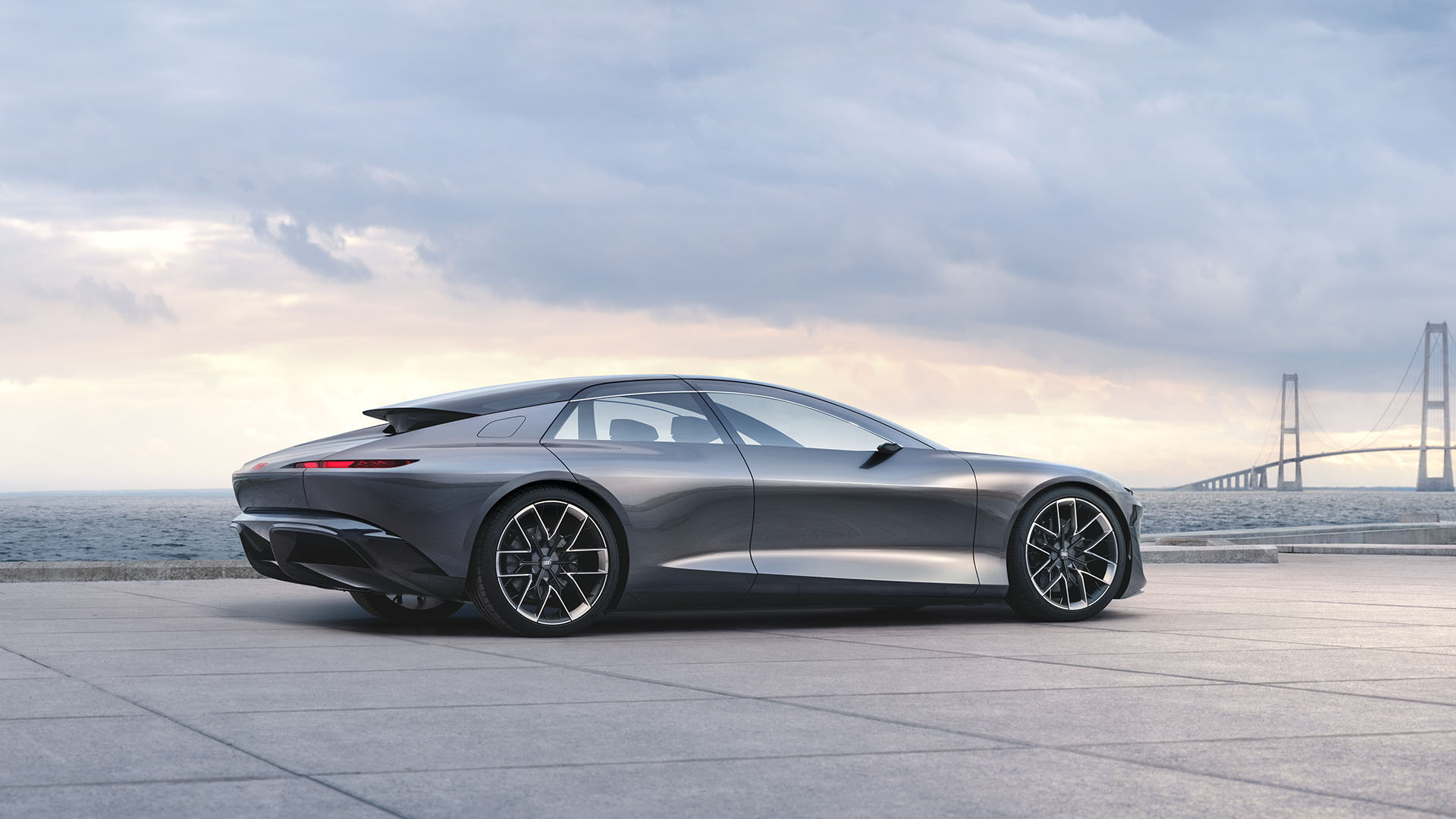 Three-quarter rear view of the Audi grandsphere concept vehicle parked.