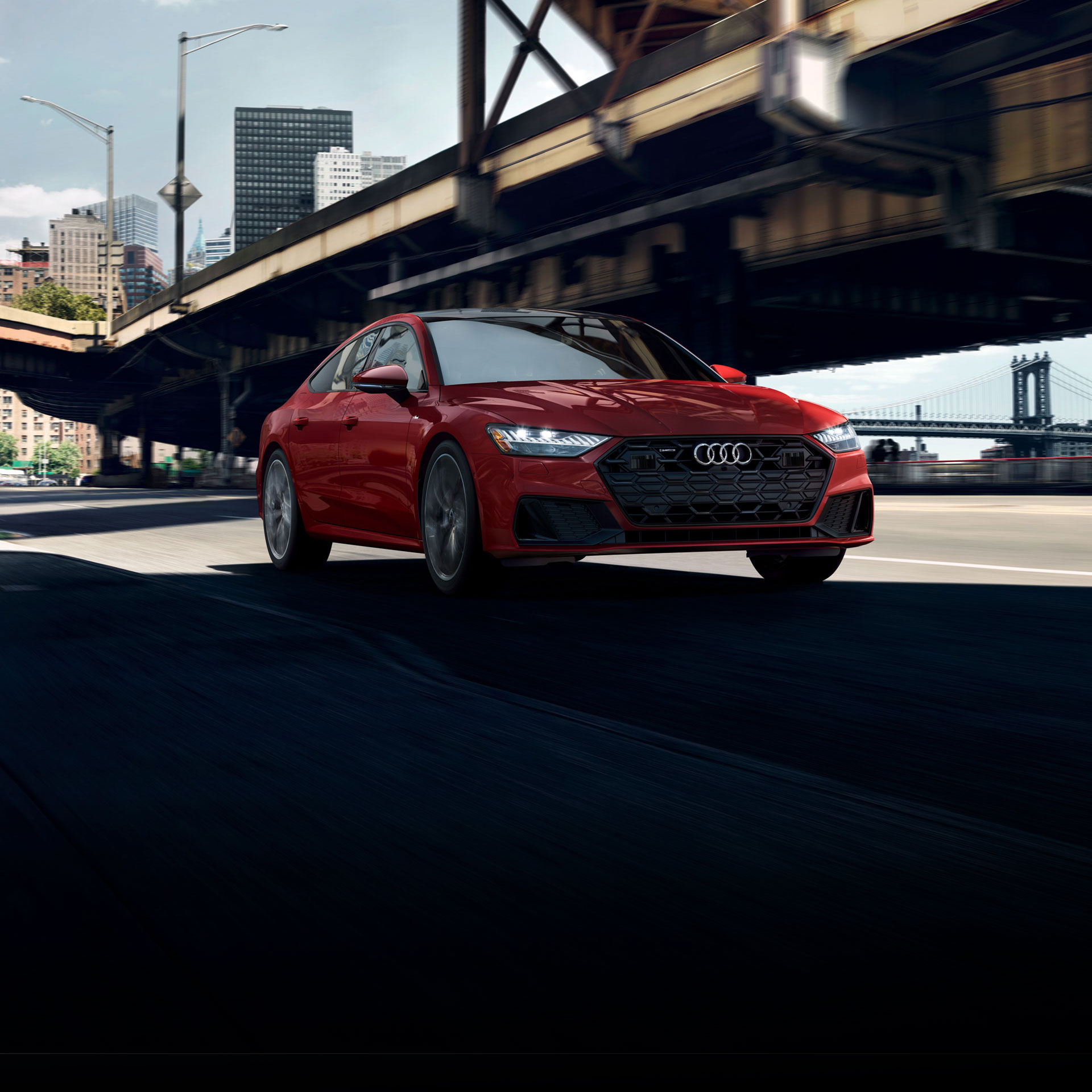 Three-quarter front view of the Audi A7 in motion.